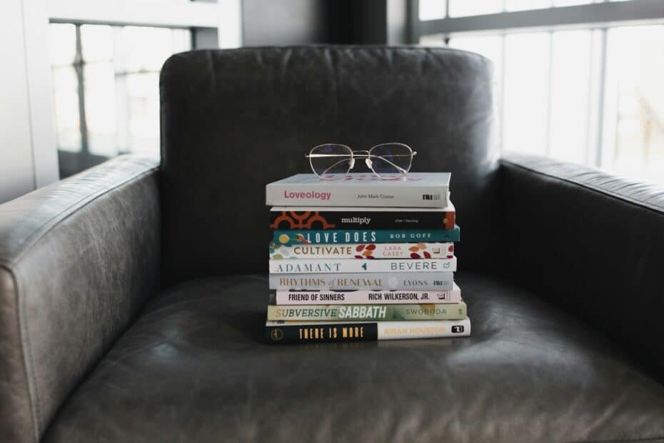 Assorted books on black couch, best self help book