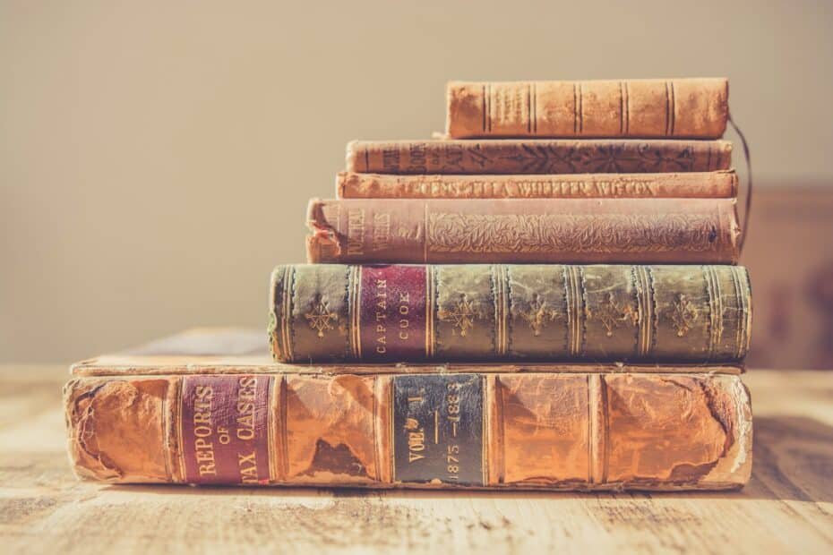 Shallow focus photography of stack of books