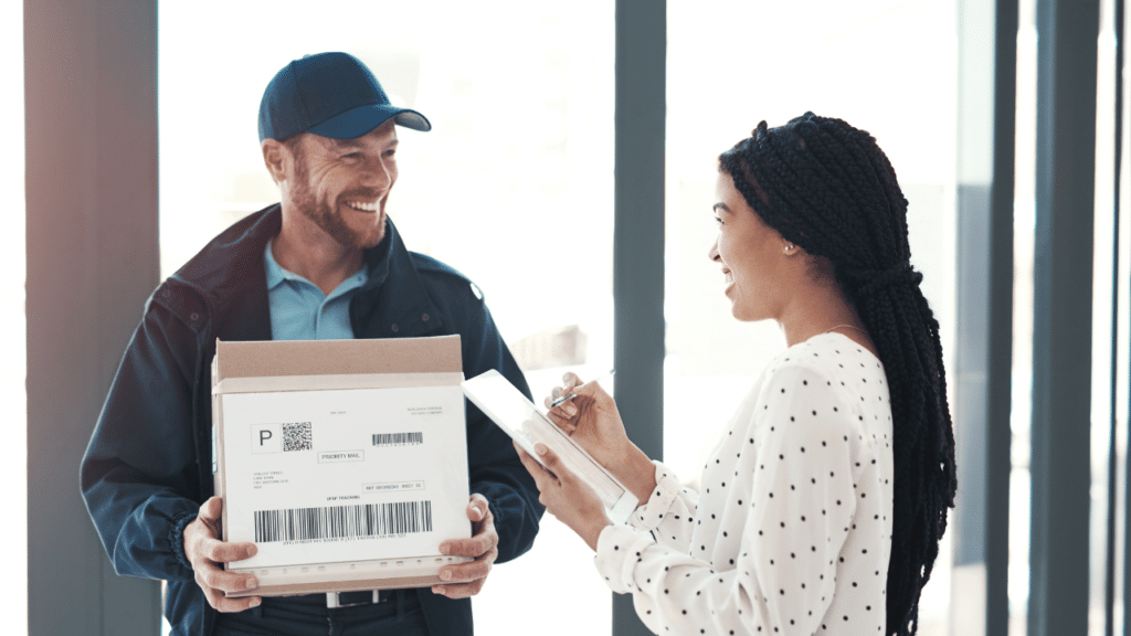 A man holding a box and a woman holding a box