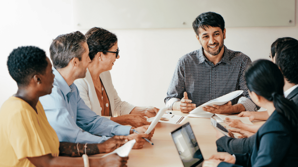 A group of people sitting around a table