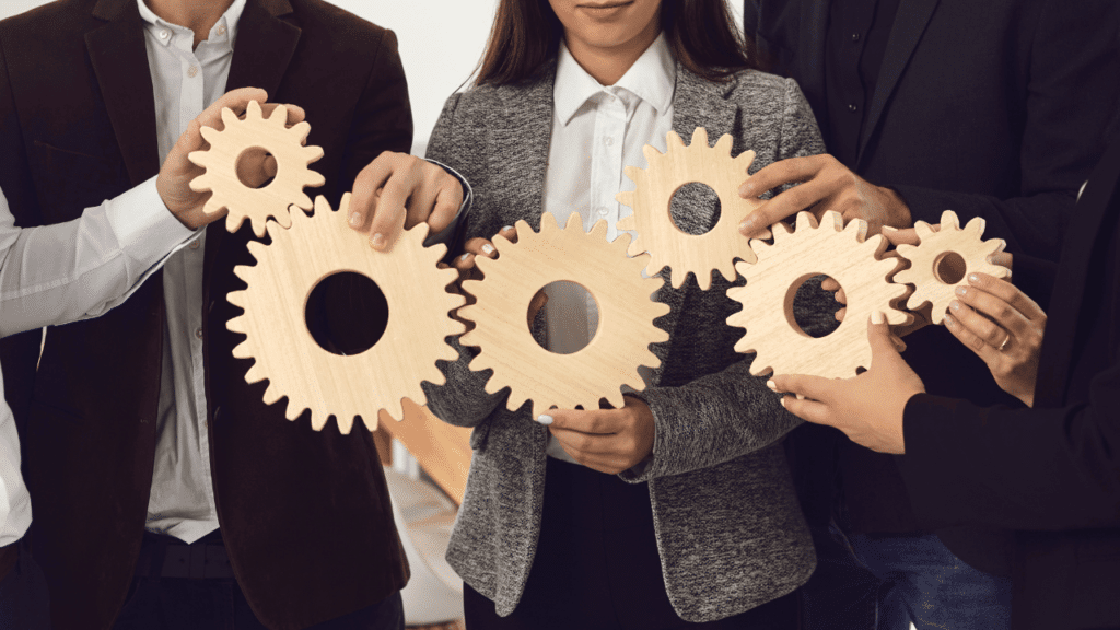 A group of people holding gears