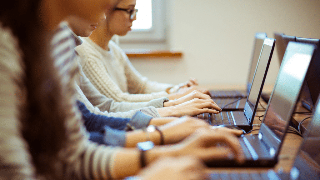 A group of people using laptops