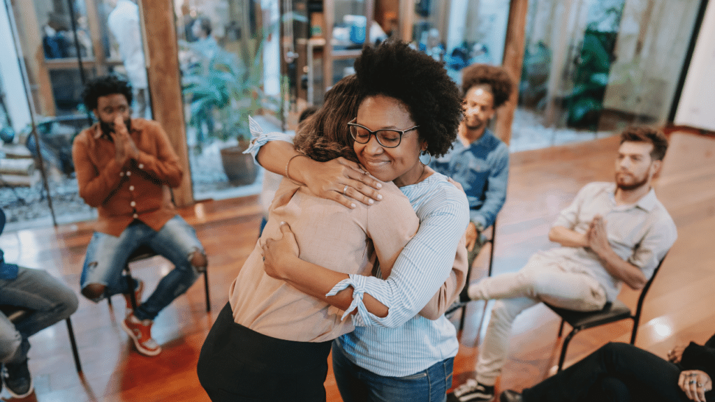 A woman hugging another woman