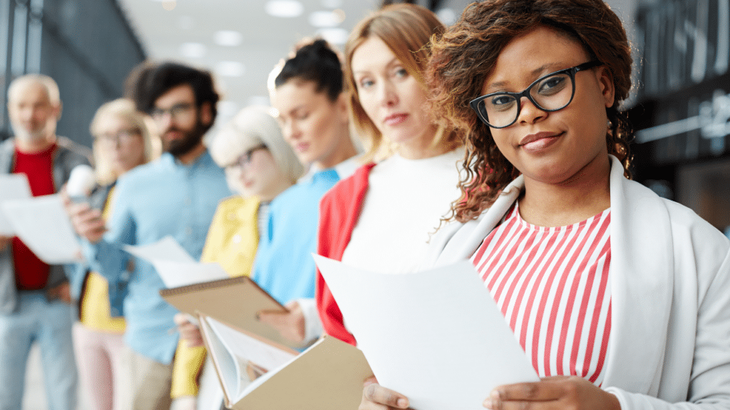 A group of people holding papers