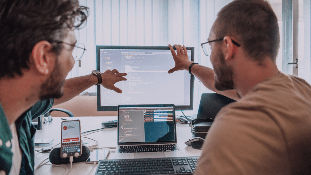 Two men working on a computer