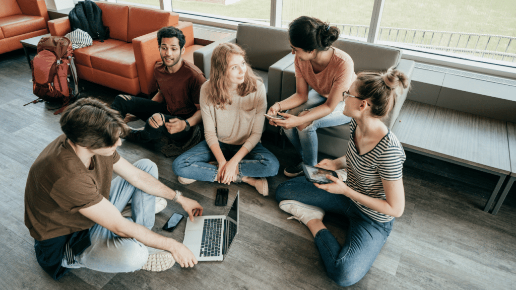 A group of people sitting on the floor