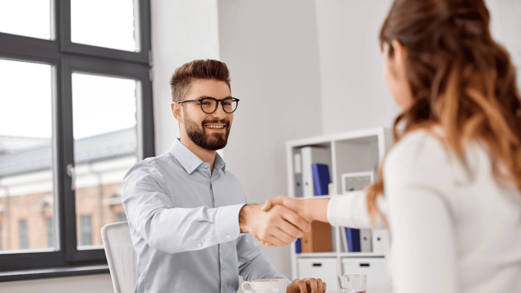 A man and woman shaking hands