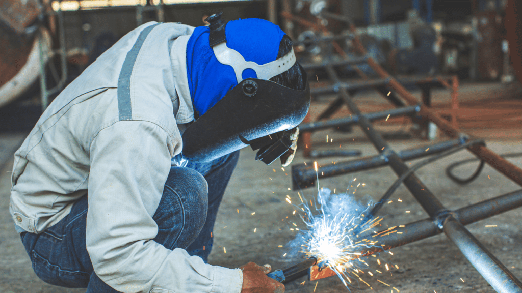 A man welding a metal object